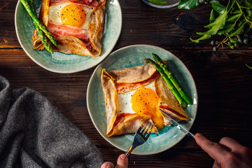Galette,French food buckwheat pancake,with egg in plate. Healthy food concept image. - obrazy, fototapety, plakaty