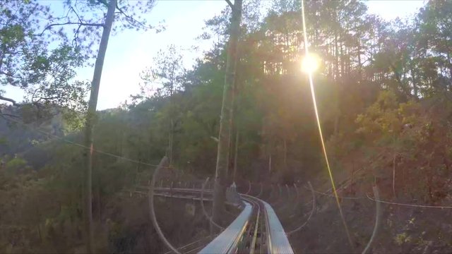DALAT. VIETNAM: Unique Slide Rail System Moves Visitors on Winding Route through the Park at Datanla Falls. Vietnam. 4k video