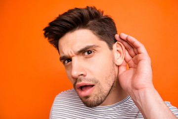 Closeup photo of silly crazy guy chatterbox hold arm near ear attentively listen friends telling...