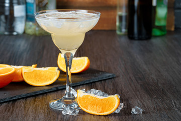 Alcoholic coktail served with orange slice close up