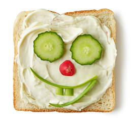 funny toasted bread with cream cheese and vegetables