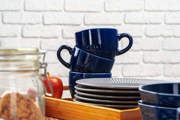 Classic blue empty ceramic tea cup on kitchen table close up