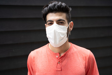 portrait of a man wearing protection face mask against coronavirus