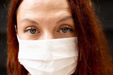 close up portrait of a girl wearing a face mask against coronavirus