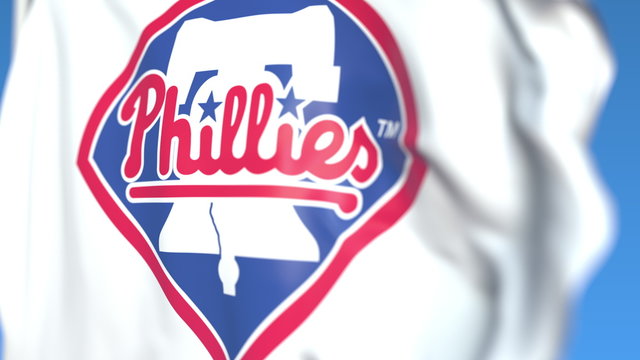Waving flag with Philadelphia Phillies team logo, close-up. Editorial 3D rendering