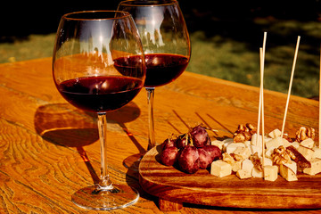 Glasses Of Fine Red Wine With Grape and cheese