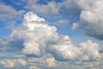 Naklejka na ściany i meble Beautiful clouds in the sky. Warm summer day
