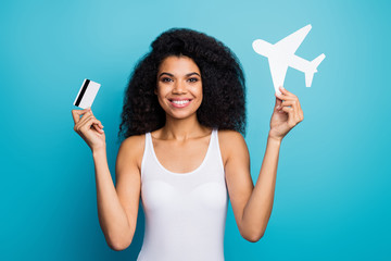 Close-up portrait of her she nice attractive cheerful wavy-haired girl holding in hands plane paper form credit card loan new life rout isolated on bright vivid shine vibrant blue color background