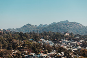 Fototapeta na wymiar View of the Mount Abu city besides the mountains at Mount Abu in Rajasthan, India