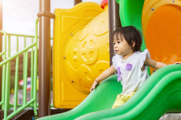 Portrait image of 1-2 yeas old baby. Happy Asian child girl smiling and laughing. She playing with...