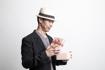 Adult Asian man  open a gift box.