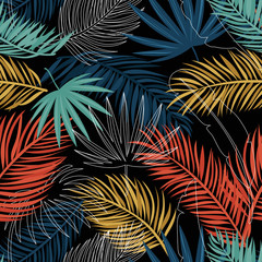 Colorful palm leaves on dark background. Tropical leaves seamless pattern.