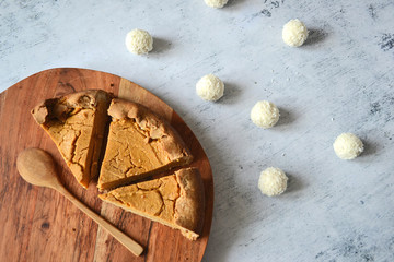 Pieces Pumpkin Cheesecake on Cutting Board