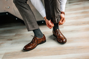 Men's leather shoes on the groom - Powered by Adobe