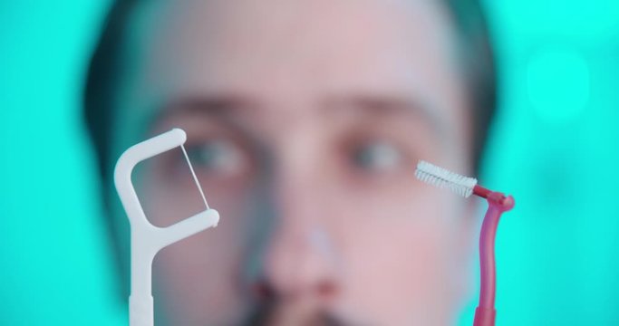 Decide between interdental brush or dental floss 4K