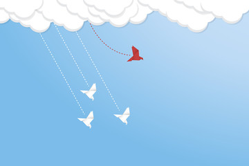 Think differently concept. Be different. Red bird changing direction. New idea, change, trend, courage, creative solution, innovation and unique way concept.	