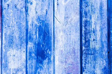 Fototapeta na wymiar Old wooden painted fence. Painted boards. Background.
