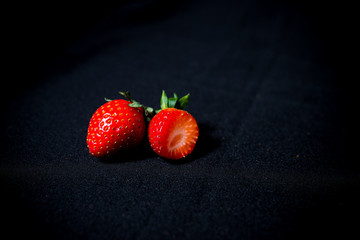 large strawberries on a black background