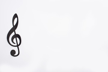 Top view of paper cut black note on white background