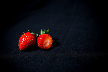 large strawberries on a black background