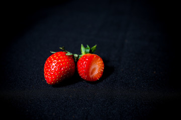 large strawberries on a black background