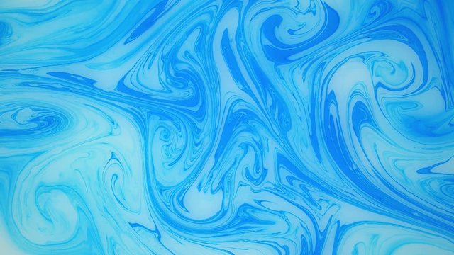 Abstract paint ink in motion. Psychedelic ebru background footage. Flowing colorful spots.