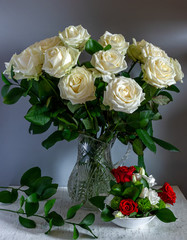 Beautiful bouquet of roses in a crystal jug. Still life. Vintage.