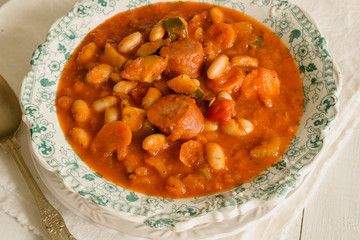 Tuscan bean soup made with cannellini beans courgettes and Italian salsiccia sausage