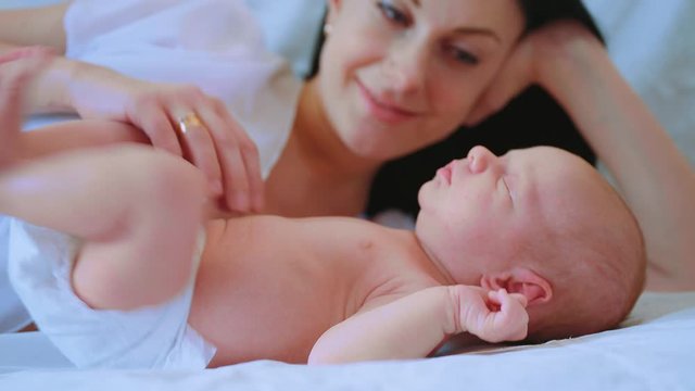 Mother and her newborn baby. Motherhood. Healthcare, love, relationship concept