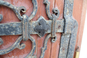 The part of the old red door with metal trim