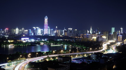 Fototapeta na wymiar The skyline at night and the city traffic in China