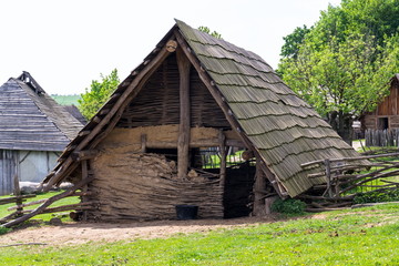 Traditional medieval wooden buildings at archaeological heritage village near Velehrad Monastery, Modra, Moravia, Czech Republic, sunny summer day