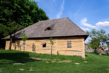 Obraz premium Traditional medieval wooden buildings at archaeological heritage village near Velehrad Monastery, Modra, Moravia, Czech Republic, sunny summer day