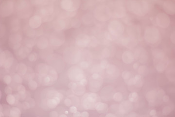 White glitter vintage lights background. White bokeh on background.