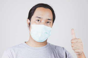 men wear face masks to protect against the covid-19 virus