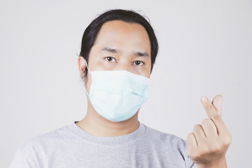 men wear face masks to protect against the covid-19 virus