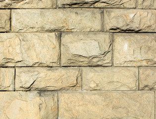 Street wall made of decorative stone. Bricklaying. the background