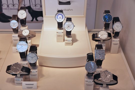 NUREMBERG, GERMANY - MAY 7, 2018: Nomos watches in a shop window in Nuremberg, Germany. Nomos Glashutte is a German watch making company since 1990.
