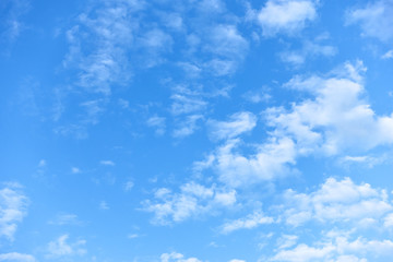 Blue sky with small white fleecy clouds