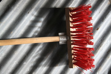 Red hard brush working brooms