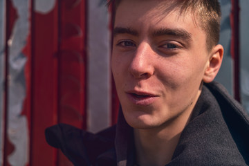 portrait of a lucky smiling young man