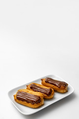 cakes chocolate icing and coffee white background