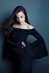 young beauty in elegant black dress - 329567758