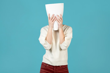 The girl hid her face behind a contract or other document