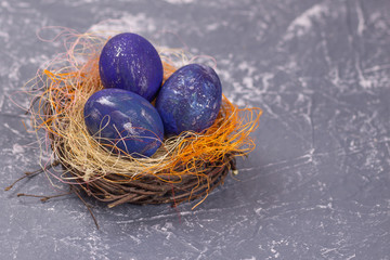 space easter eggs on gray background. Selective focus. Copy space