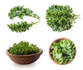 Kale leaves isolated on white background. Top view. Kale leaves with copy space for text. Herbs isolated on white. Kale in a wooden bowl on white background. Kale from different angles on white.