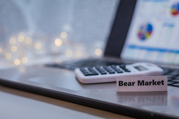 Bear Market business finance doom gloom concept with laptop and stock chart
