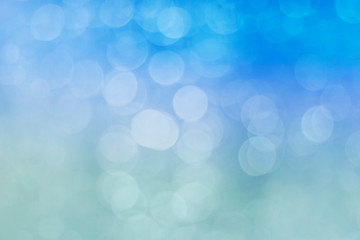 Fototapeta premium bokeh glitter lights, winter blue background