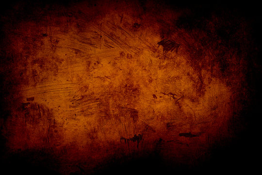 orange grunge background or texture with black vignette borders