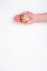 Easter egg in hands on a white isolated background.